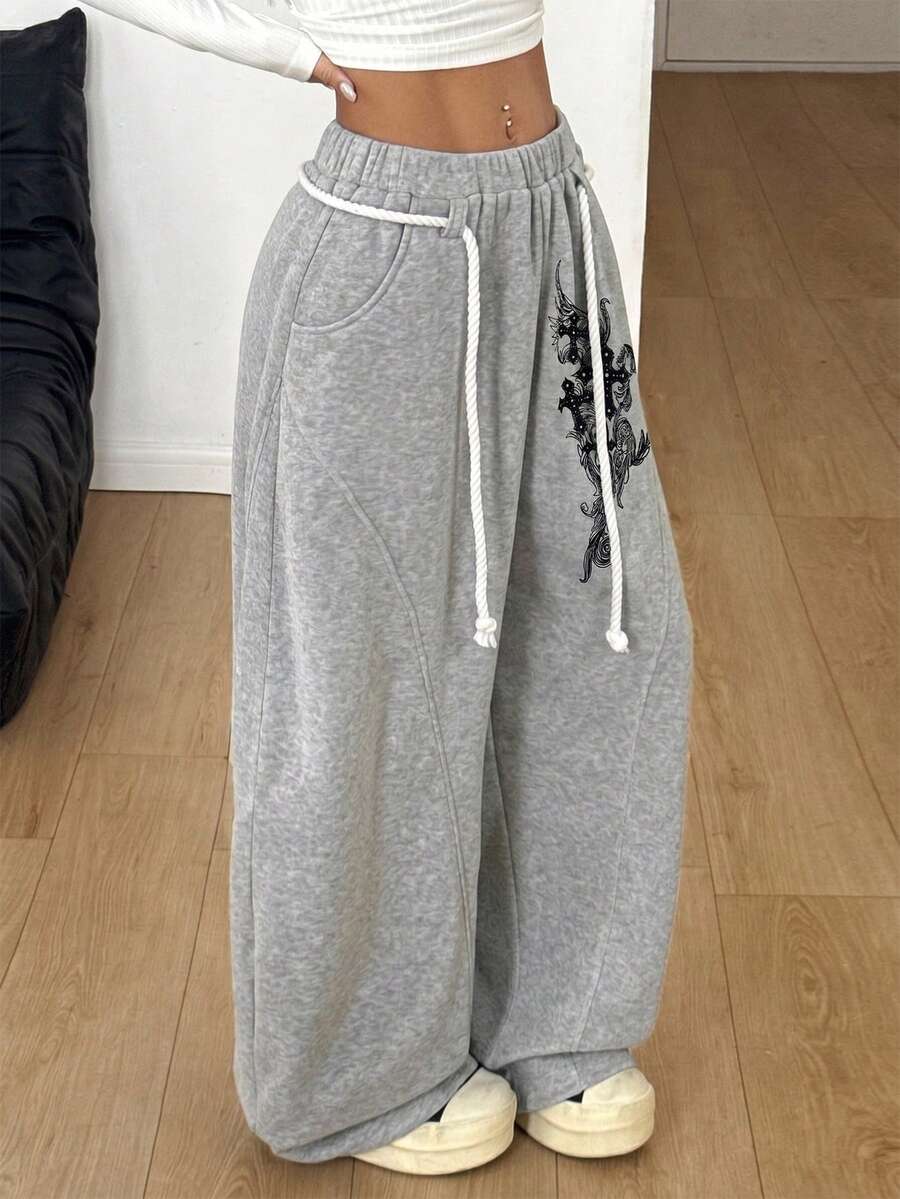 Women's casual grey plaid sweatpants featuring an elastic drawstring waistband, side pockets, and a relaxed loose fit.