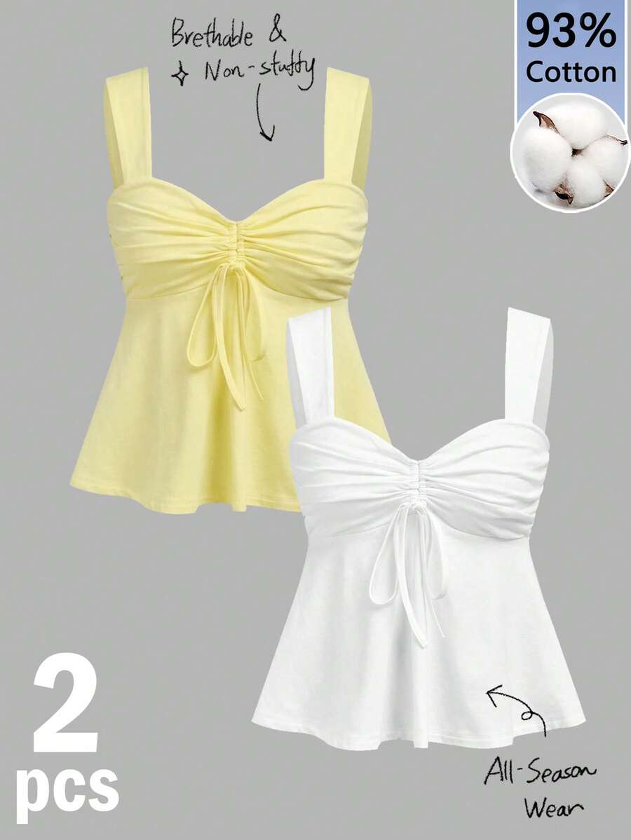 Women's white wide strap tank top with drawstring front, eyelet embroidery, ruffle hem, slim fit, and flared hem.