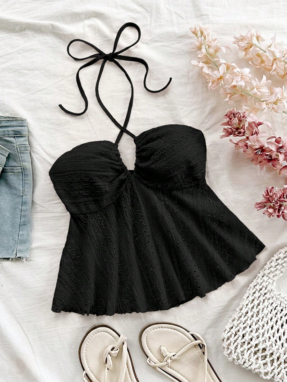 Women's textured V-neck halter tank top with backless knot detail, ruffle hem, and flared silhouette for casual beach and vacation wear.