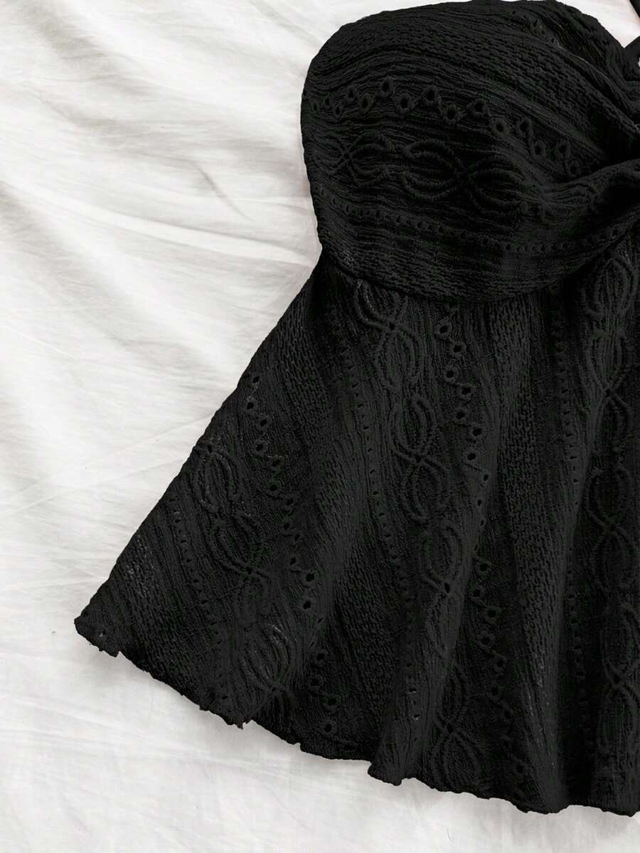 Women's textured V-neck halter tank top with backless knot detail, ruffle hem, and flared silhouette for casual beach and vacation wear.