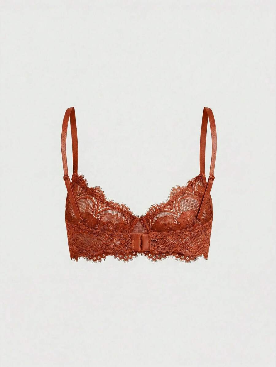 Sheer floral lace underwire triangle bra for women featuring adjustable straps and plunge cup design.
