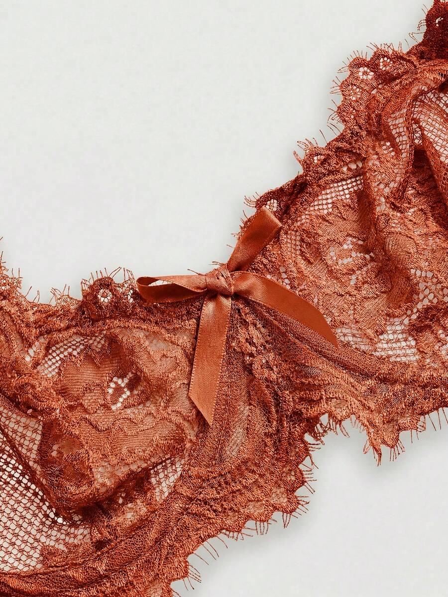 Sheer floral lace underwire triangle bra for women featuring adjustable straps and plunge cup design.