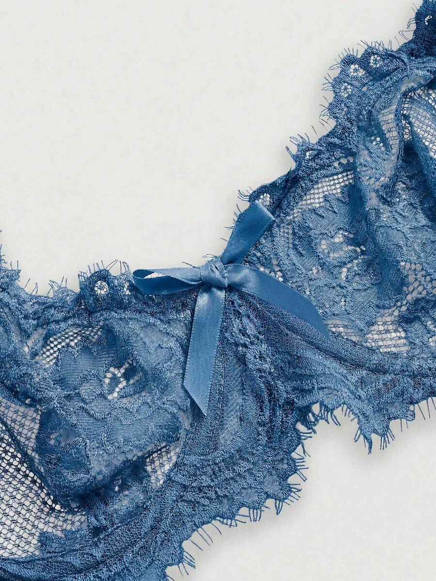 Sheer floral lace underwire triangle bra for women featuring adjustable straps and plunge cup design.