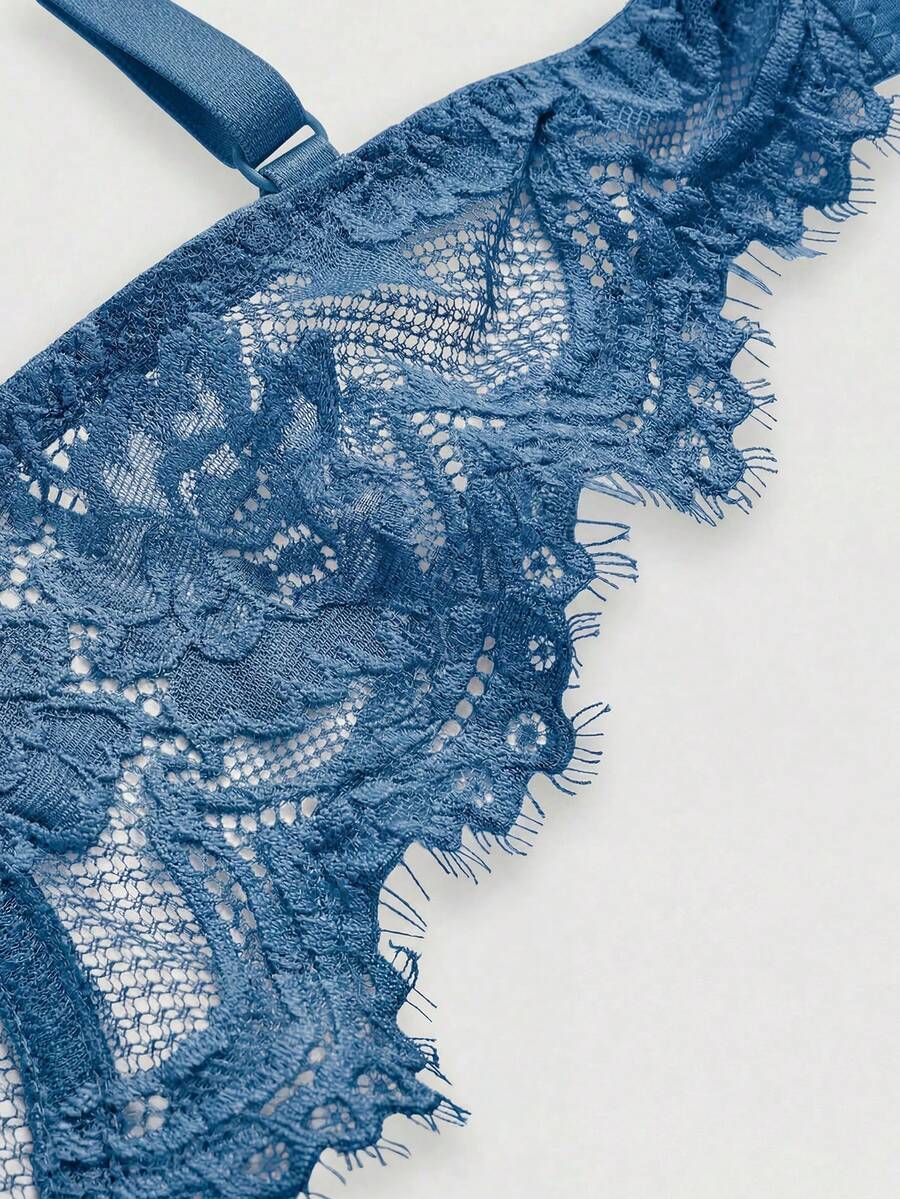Sheer floral lace underwire triangle bra for women featuring adjustable straps and plunge cup design.