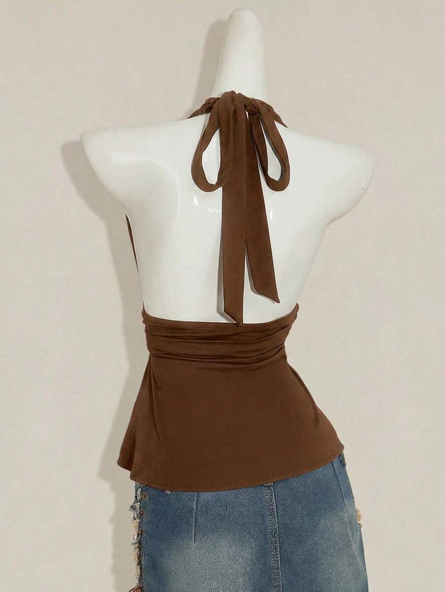 Women's backless halter babydoll tank top featuring a square neckline, slim fit silhouette, and a flared ruffle hem.