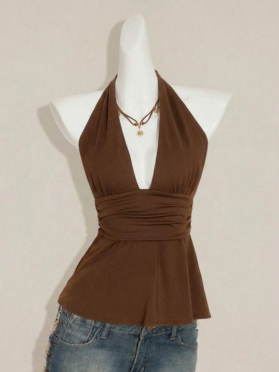 Women's backless halter babydoll tank top featuring a square neckline, slim fit silhouette, and a flared ruffle hem.