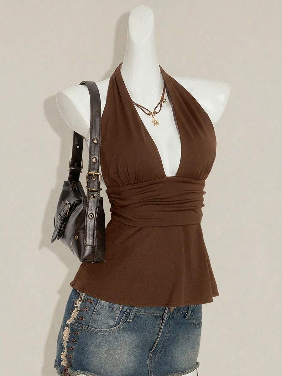 Women's backless halter babydoll tank top featuring a square neckline, slim fit silhouette, and a flared ruffle hem.