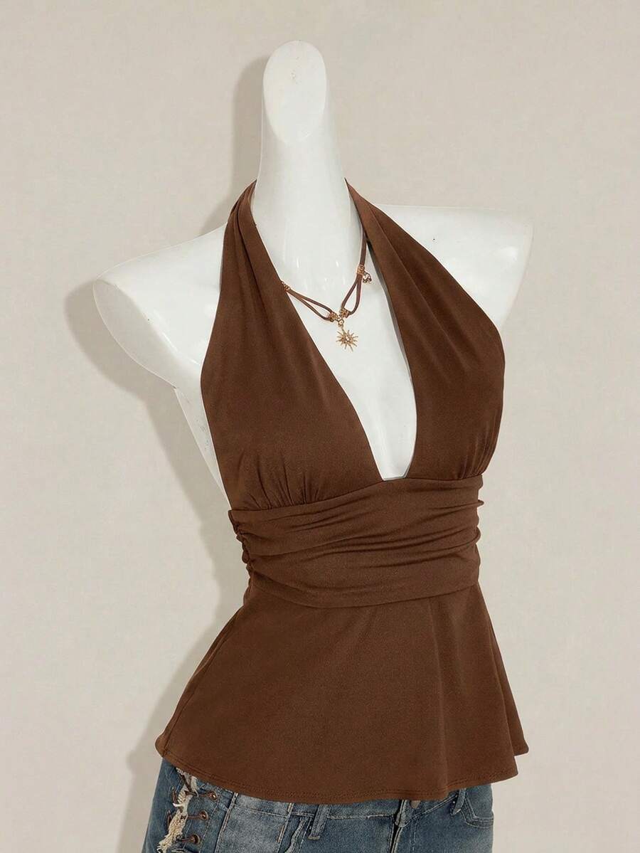 Women's backless halter babydoll tank top featuring a square neckline, slim fit silhouette, and a flared ruffle hem.