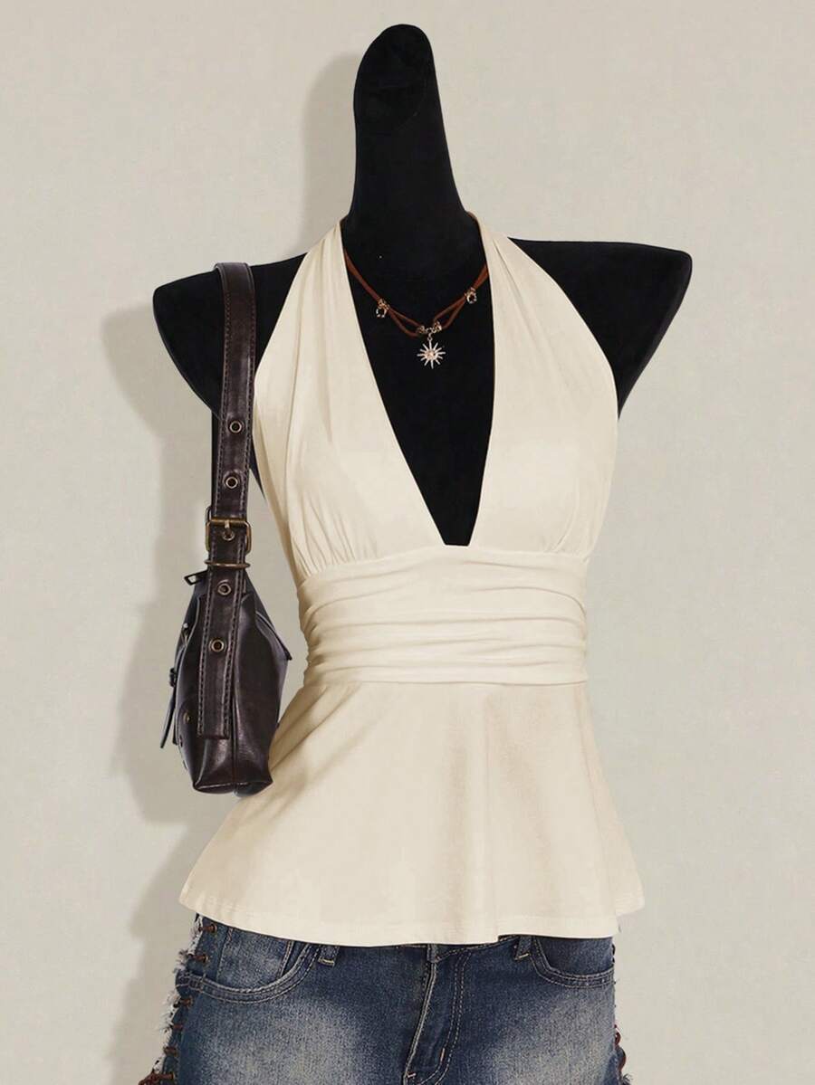 Women's backless halter babydoll tank top featuring a square neckline, slim fit silhouette, and a flared ruffle hem.