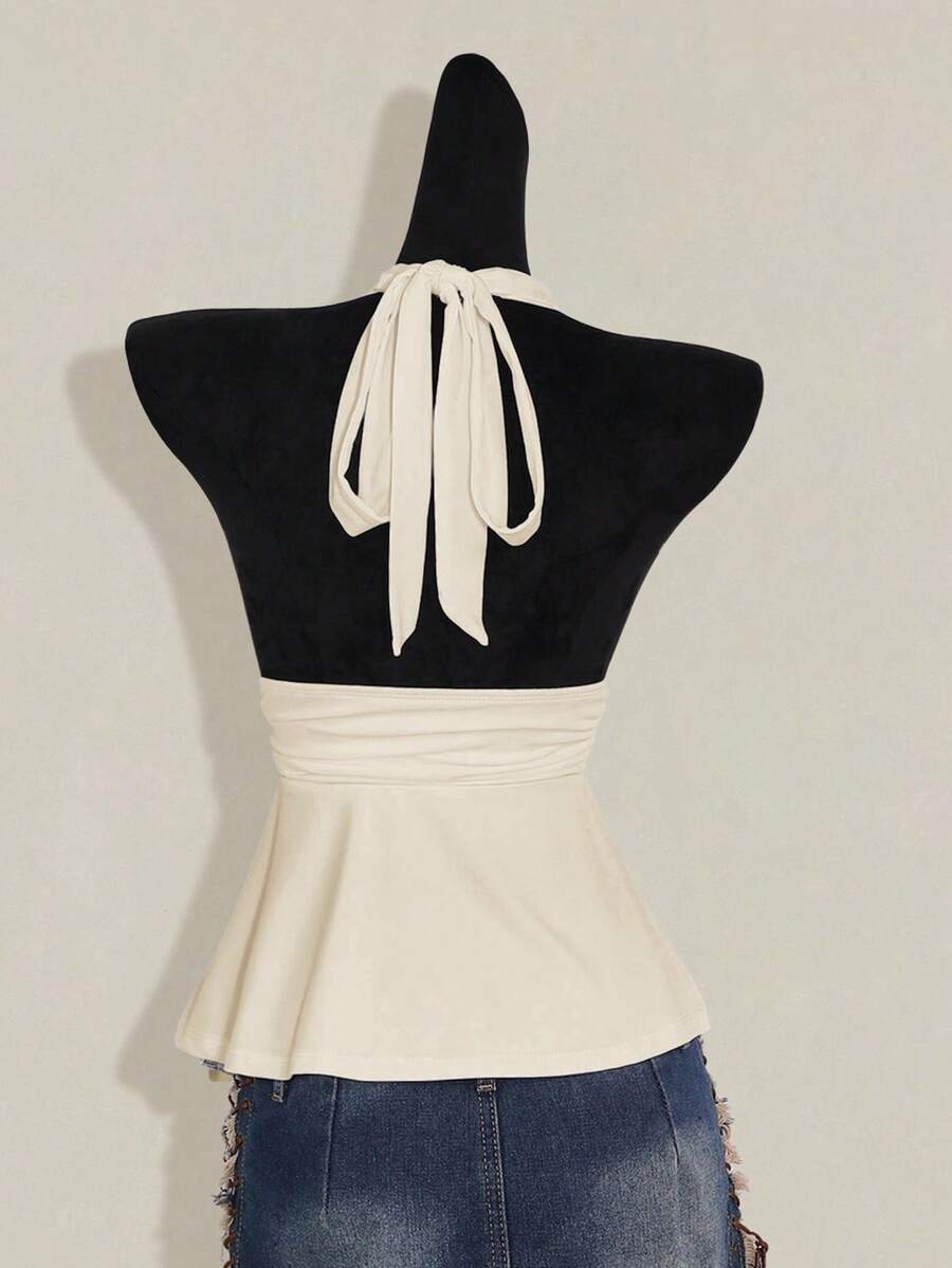 Women's backless halter babydoll tank top featuring a square neckline, slim fit silhouette, and a flared ruffle hem.