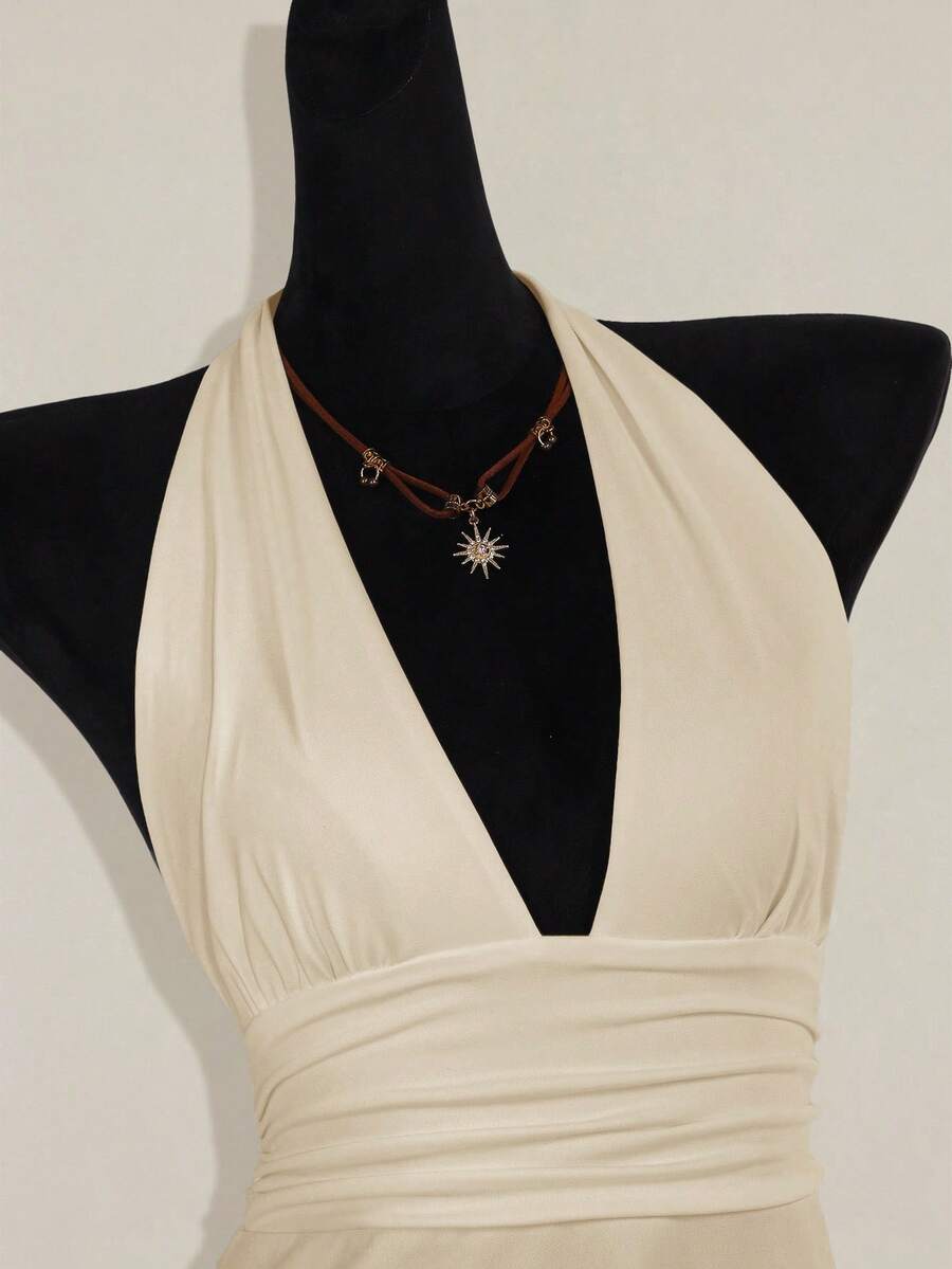 Women's backless halter babydoll tank top featuring a square neckline, slim fit silhouette, and a flared ruffle hem.