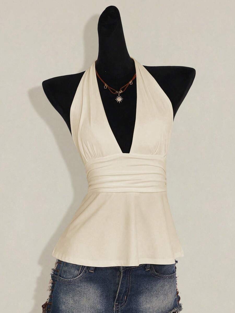 Women's backless halter babydoll tank top featuring a square neckline, slim fit silhouette, and a flared ruffle hem.