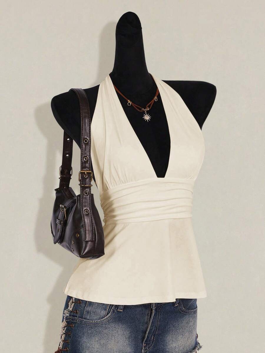 Women's backless halter babydoll tank top featuring a square neckline, slim fit silhouette, and a flared ruffle hem.