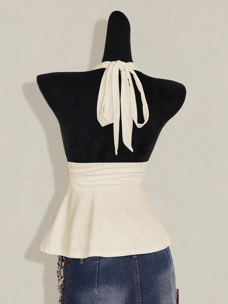Women's backless halter babydoll tank top featuring a square neckline, slim fit silhouette, and a flared ruffle hem.