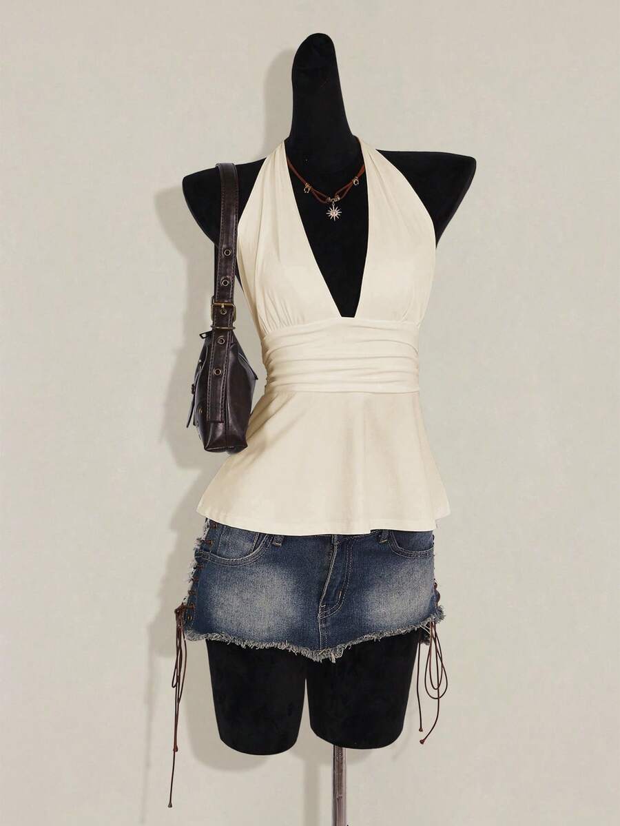 Women's backless halter babydoll tank top featuring a square neckline, slim fit silhouette, and a flared ruffle hem.