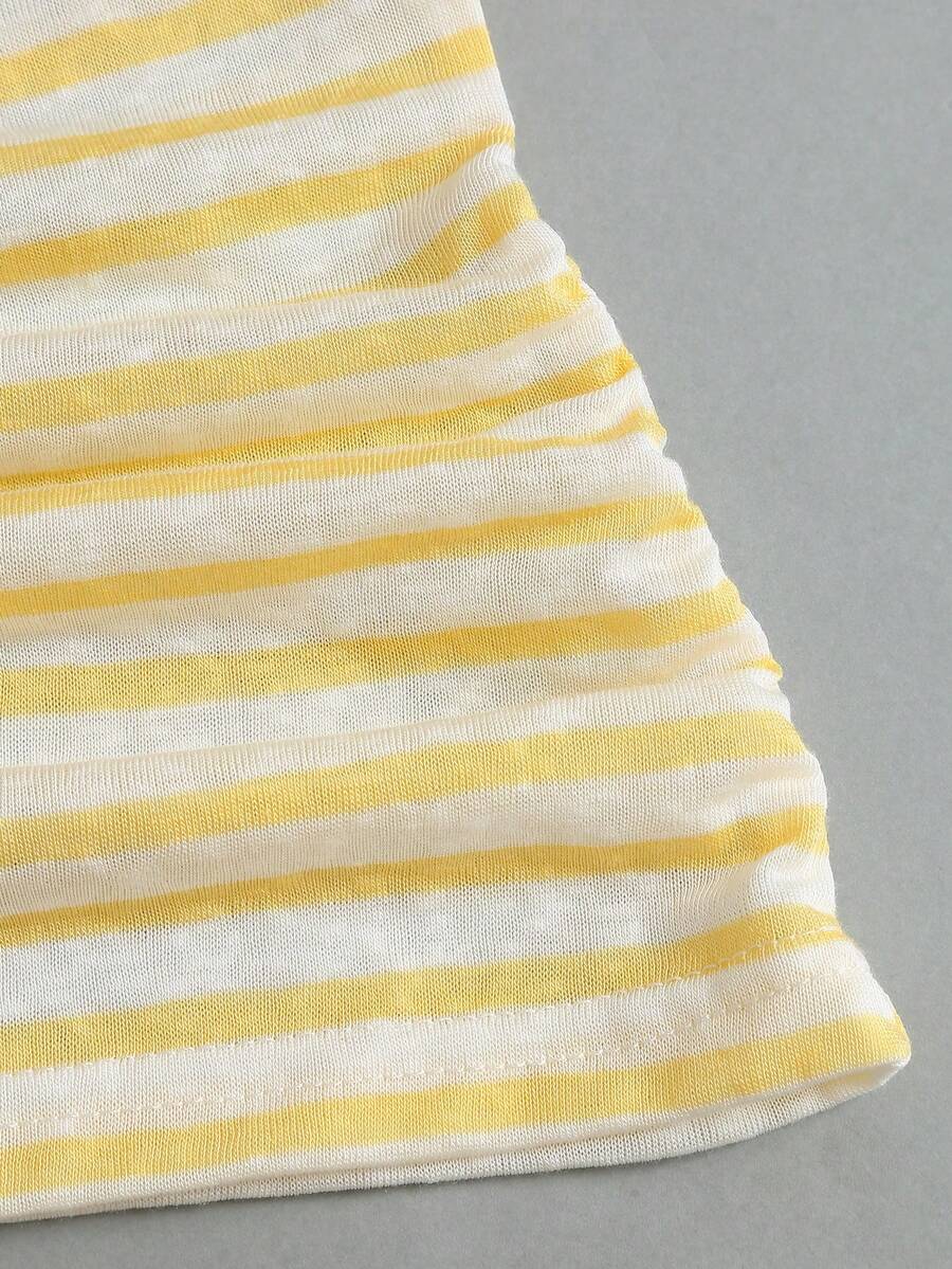 Women's striped tank top featuring an asymmetrical cold shoulder neckline and semi-sheer back.