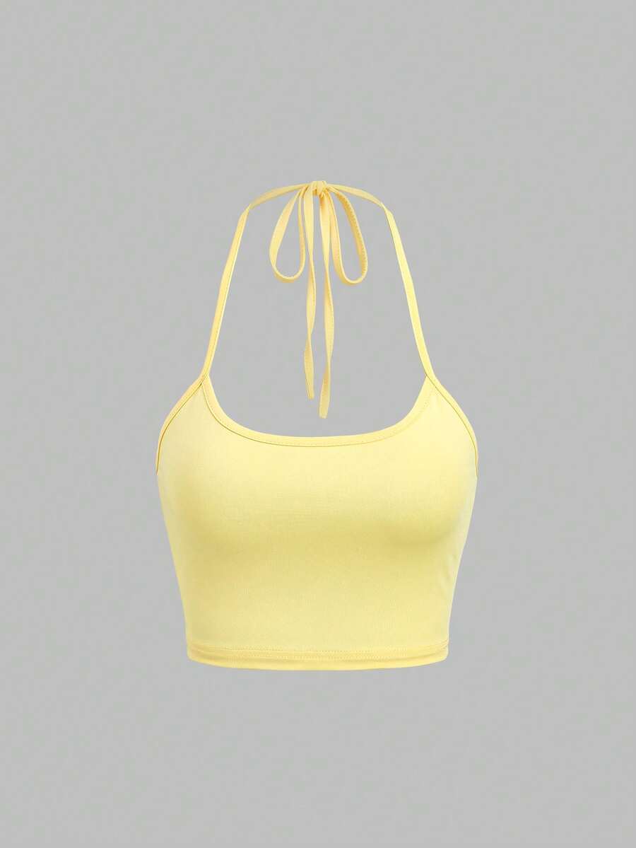 Women's striped tank top featuring an asymmetrical cold shoulder neckline and semi-sheer back.
