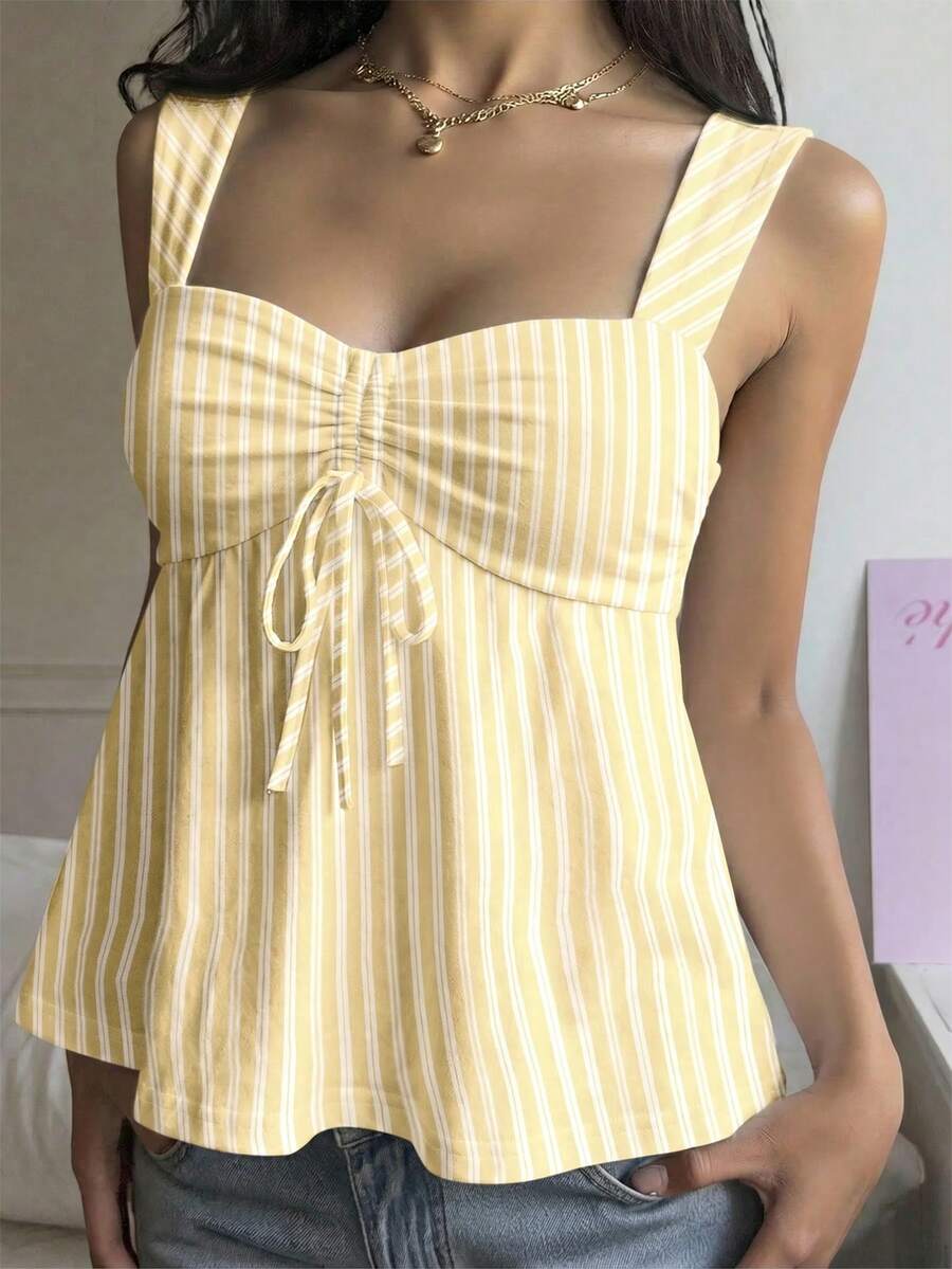 Women's striped camisole tank top with strap neckline, backless knot detail, cold shoulder styling, slim fit, and flared hem for casual vacation or daily wear.
