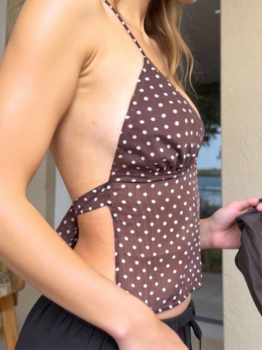 Women's polka dot halter tank top featuring neck straps, a backless tie-back design, regular hem, loose fit, and woven polyester fabric.