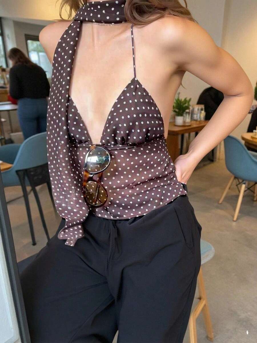 Women's polka dot halter tank top featuring neck straps, a backless tie-back design, regular hem, loose fit, and woven polyester fabric.