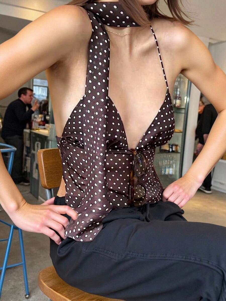 Women's polka dot halter tank top featuring neck straps, a backless tie-back design, regular hem, loose fit, and woven polyester fabric.