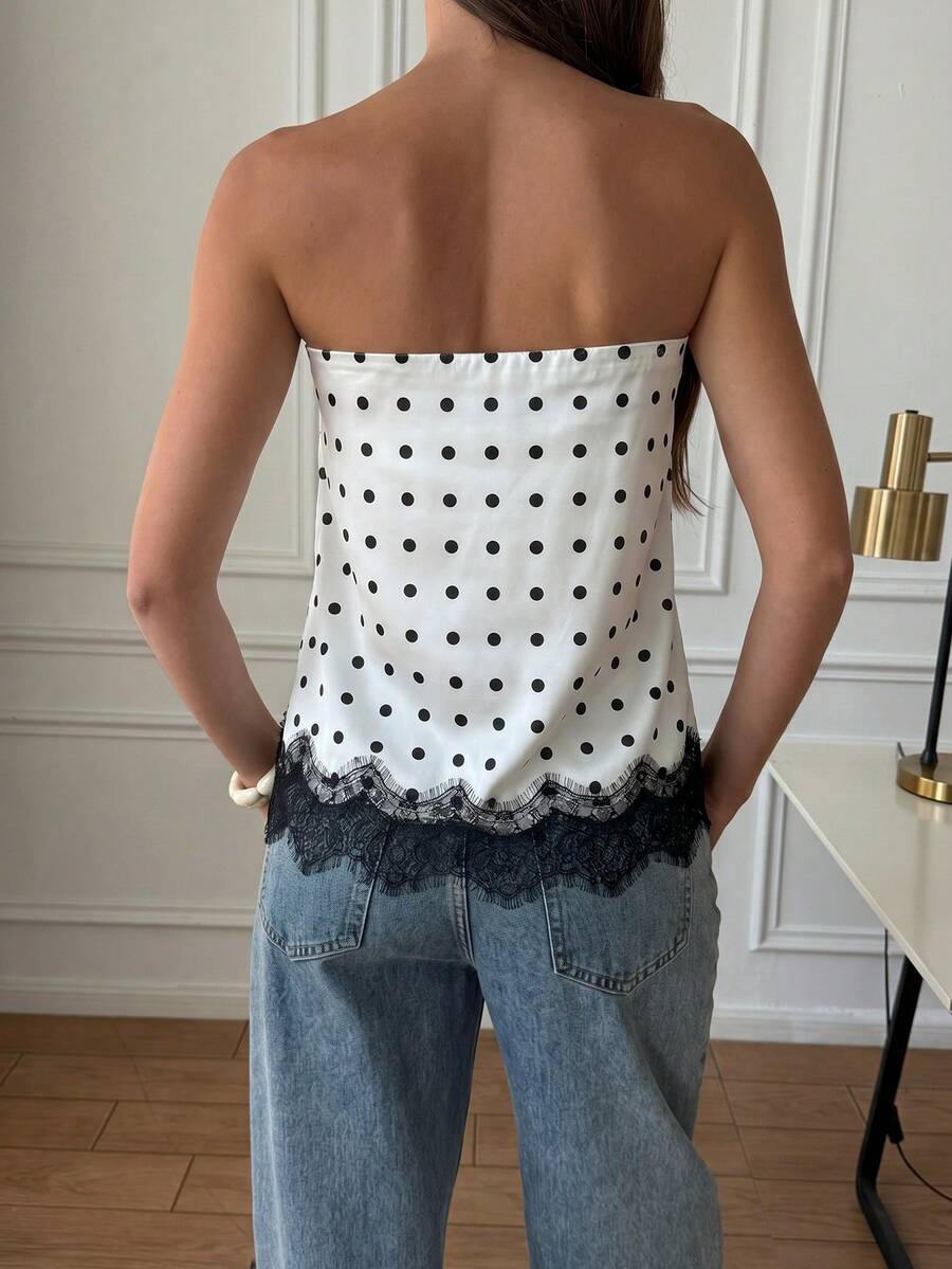 Strapless black and white bandeau top featuring a contrast lace patchwork flared hem and plant pattern.