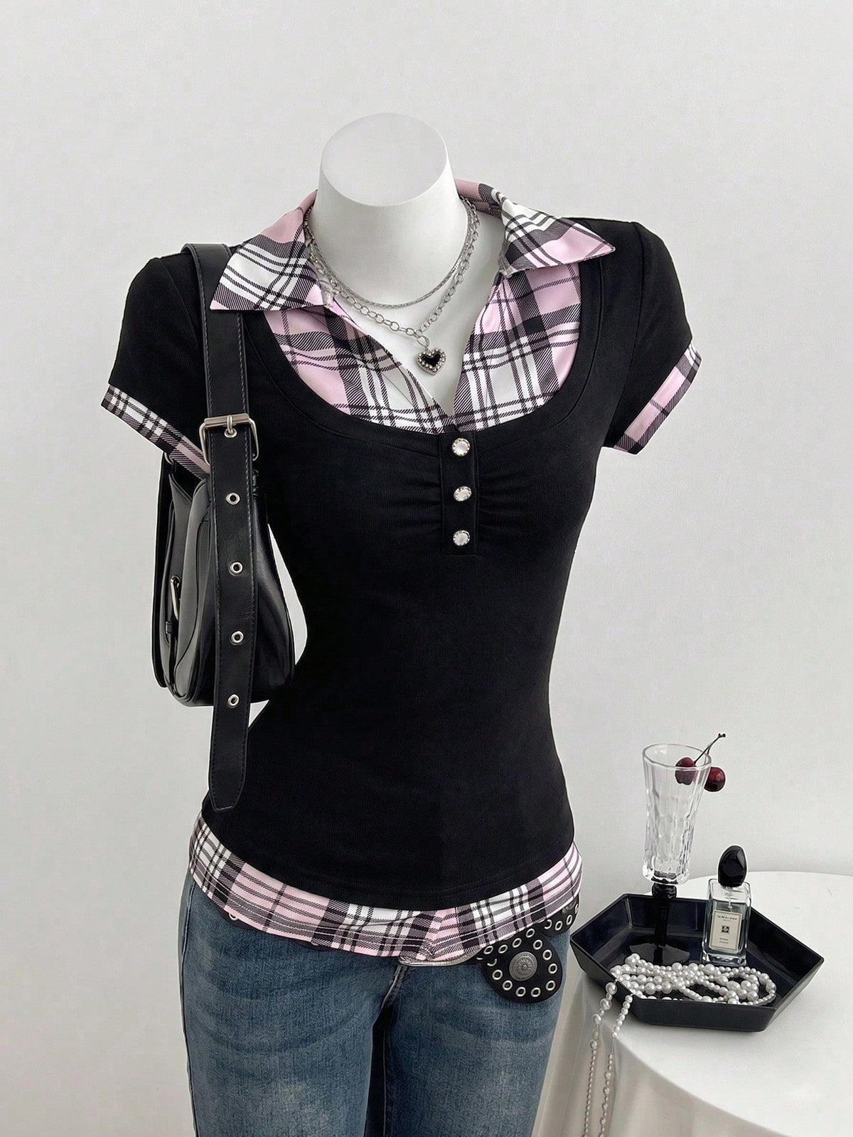 Women's black short sleeve slim fit 2-in-1 t-shirt with a plaid patchwork shirt collar detail.