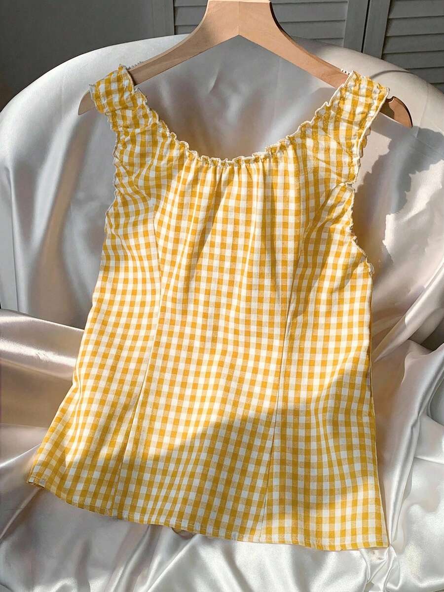 Women's red gingham smocked tank top with scoop neck, ruffle hem, and bow knot detail
