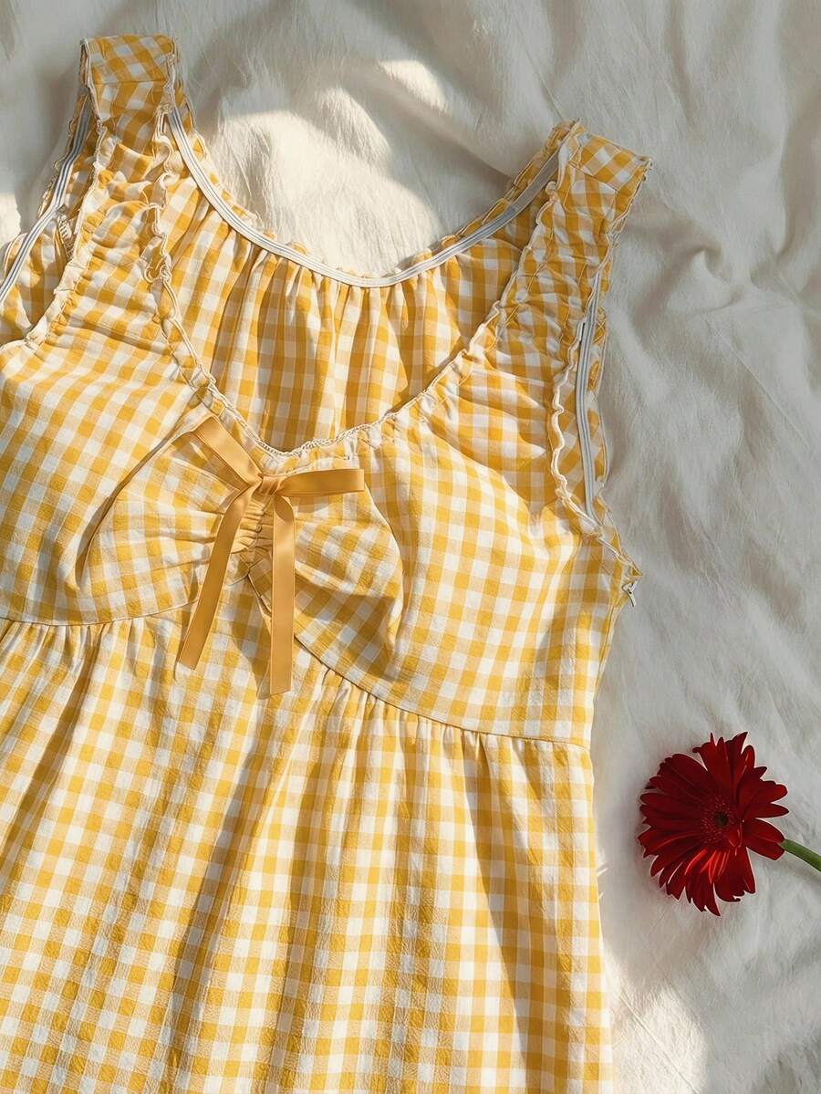 Women's red gingham smocked tank top with scoop neck, ruffle hem, and bow knot detail
