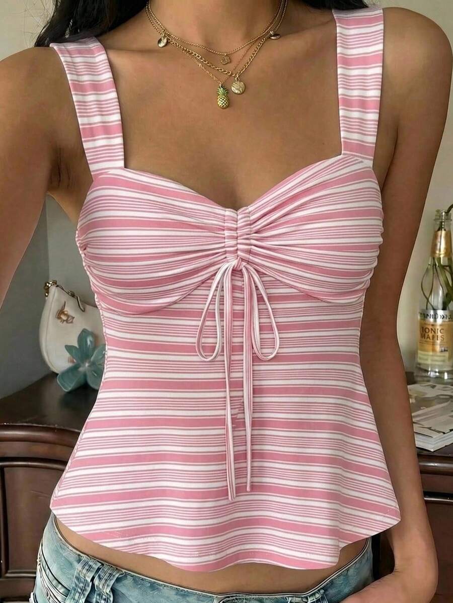 Women's striped camisole tank top with strap neckline, backless knot detail, cold shoulder styling, slim fit, and flared hem for casual vacation or daily wear.