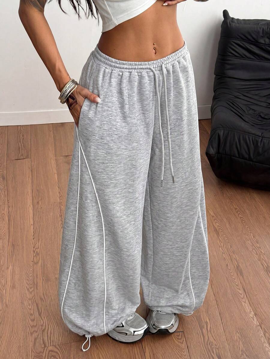 Women's wide leg trousers with a tree branch graphic pattern, loose fit, and mid-rise waist in woven fabric.