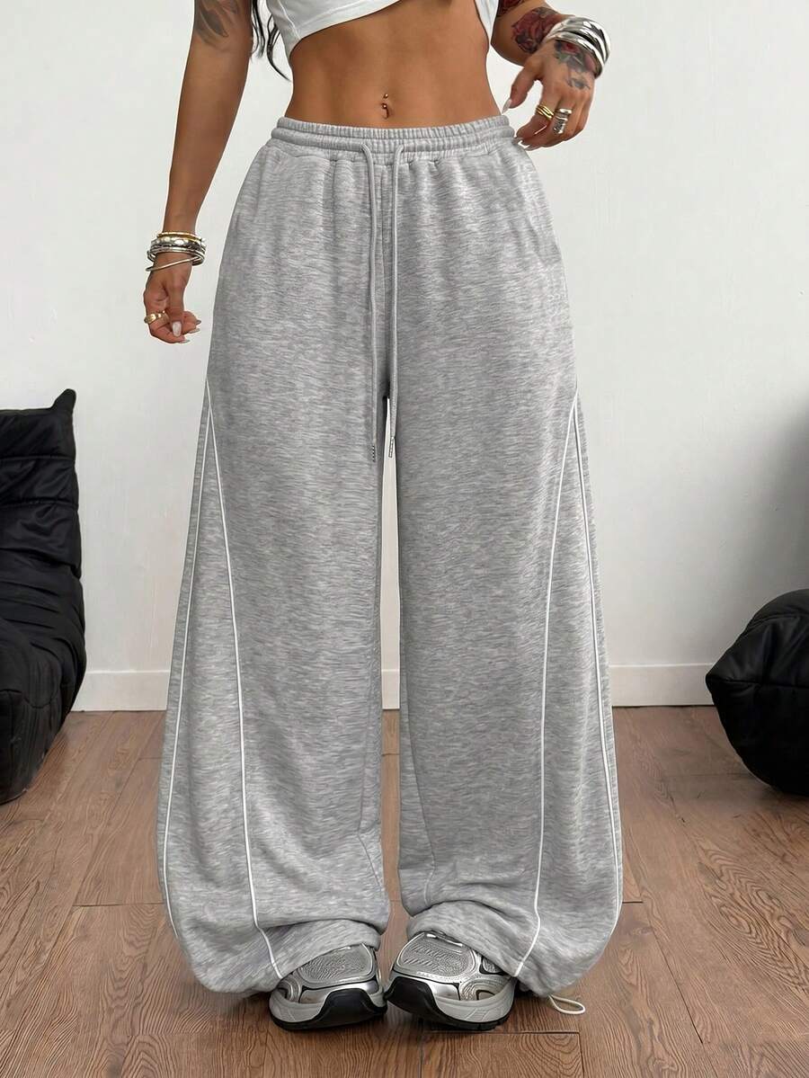 Women's wide leg trousers with a tree branch graphic pattern, loose fit, and mid-rise waist in woven fabric.