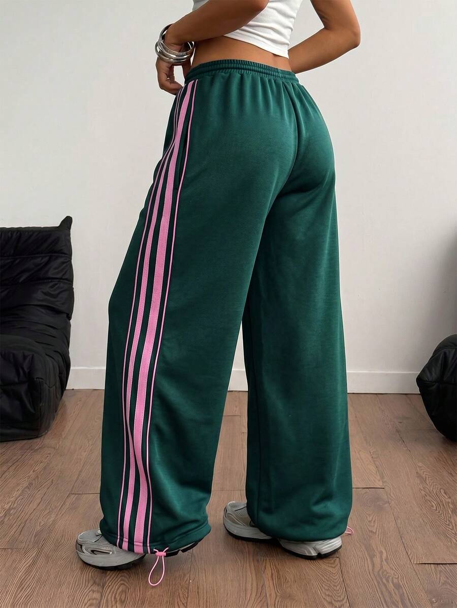 Women's wide leg trousers with a tree branch graphic pattern, loose fit, and mid-rise waist in woven fabric.