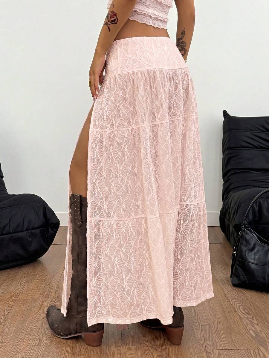 Women's red plaid long skirt featuring a low-rise waist and a side slit in lightweight woven fabric.