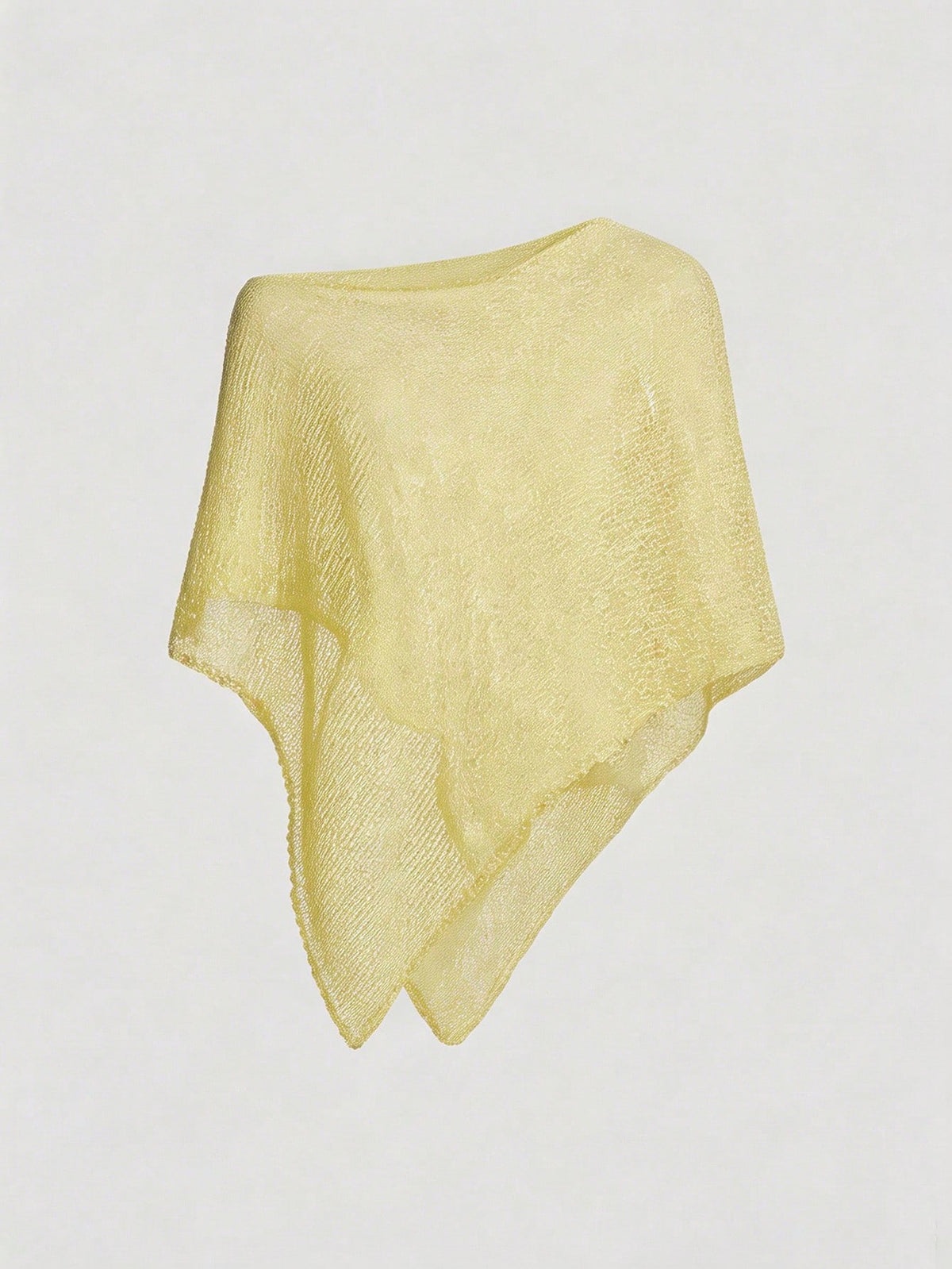 Women's casual hollow knit poncho top with boat neck, cloak sleeves, and asymmetrical hem