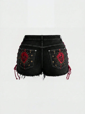 Plus size black gothic mini shorts with heart embroidery, graphic pocket pattern, lace-up detail, raw hem, and zipper fly