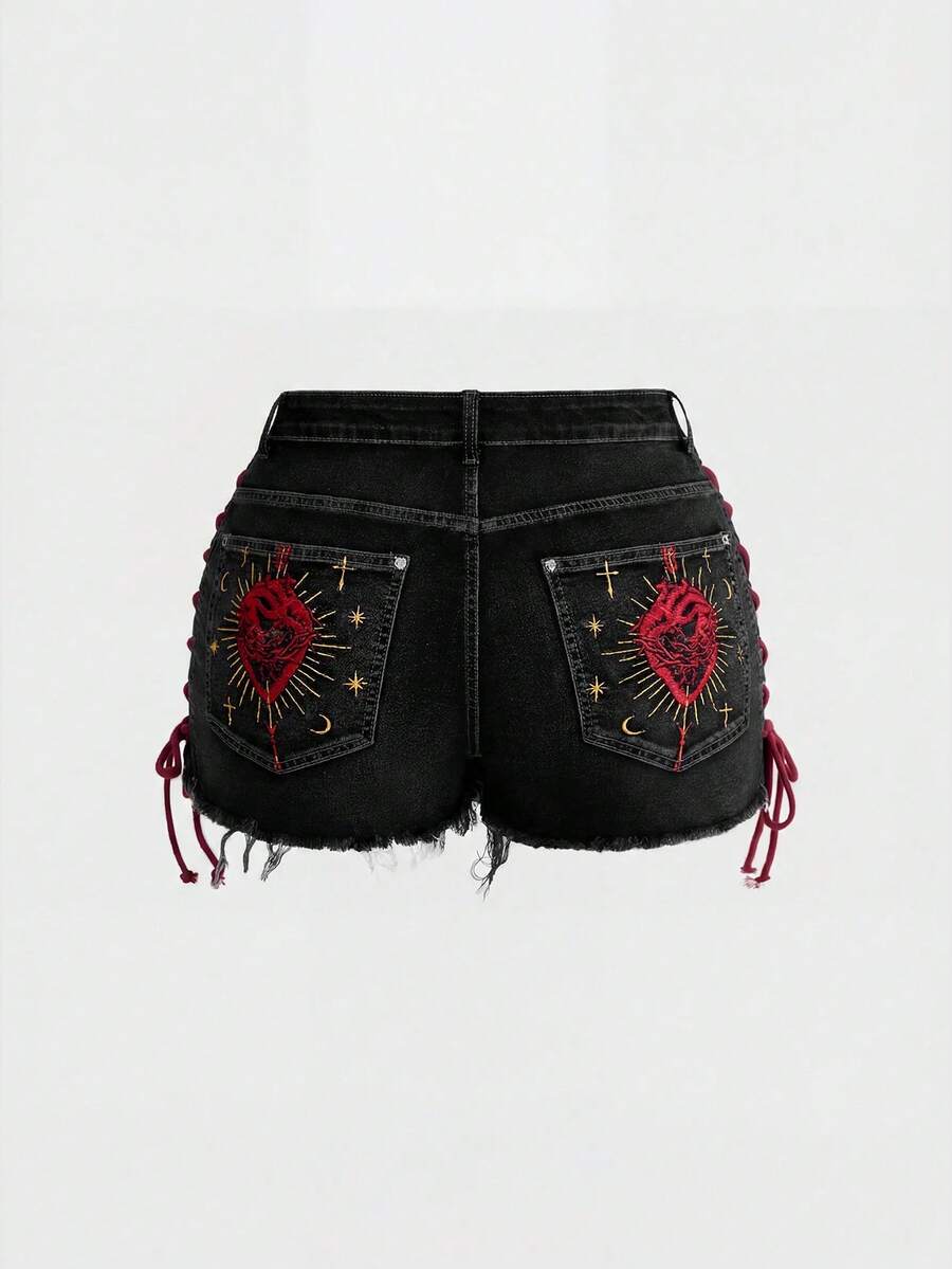 Plus size black gothic mini shorts with heart embroidery, graphic pocket pattern, lace-up detail, raw hem, and zipper fly