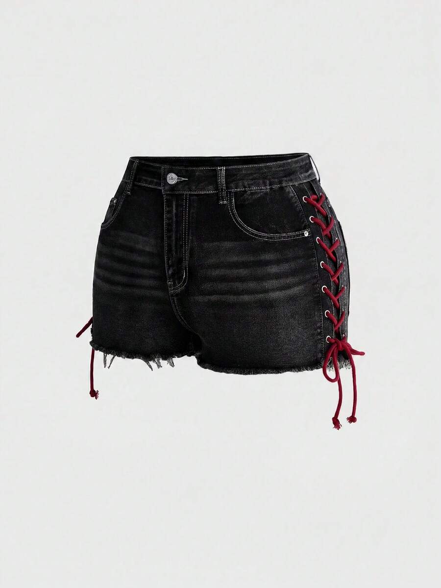 Plus size black gothic mini shorts with heart embroidery, graphic pocket pattern, lace-up detail, raw hem, and zipper fly