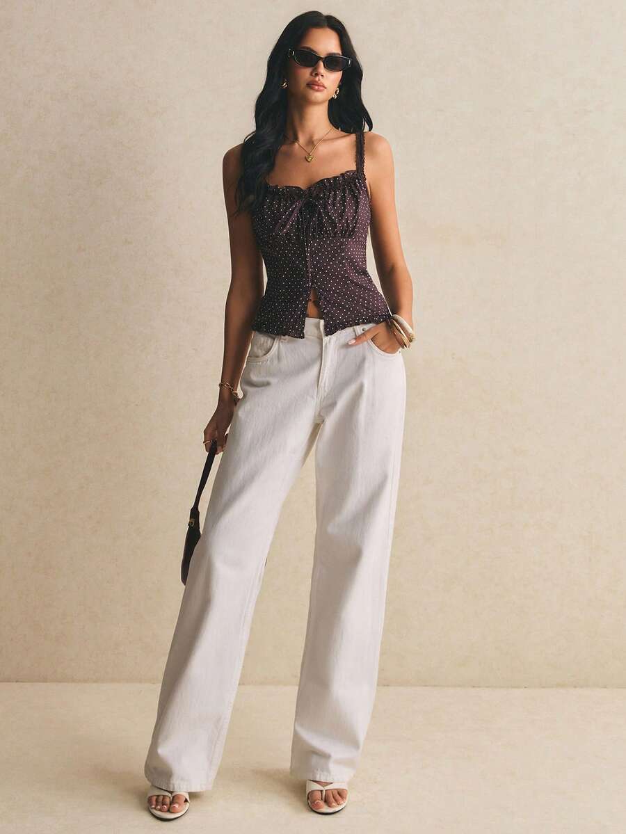 Women's casual ruffle trim wide strap tank top featuring a slim fit, strap neckline, slit hem, and woven fabric design.