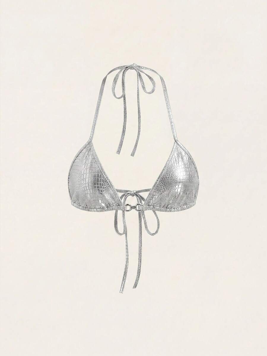 Women's slim fit halter crop top featuring a backless cut with knot and rhinestone accents.