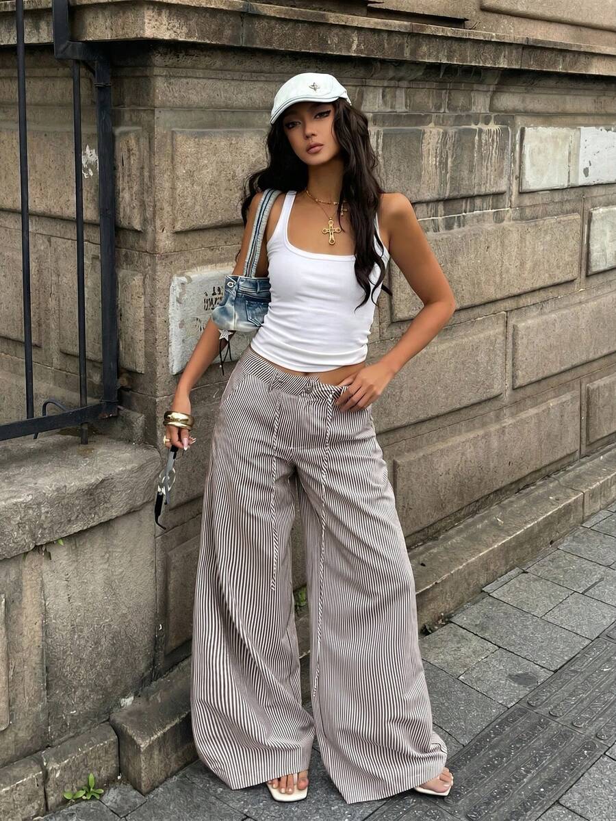 Women's casual straight leg striped woven pants featuring a low waist and zipper fly closure.