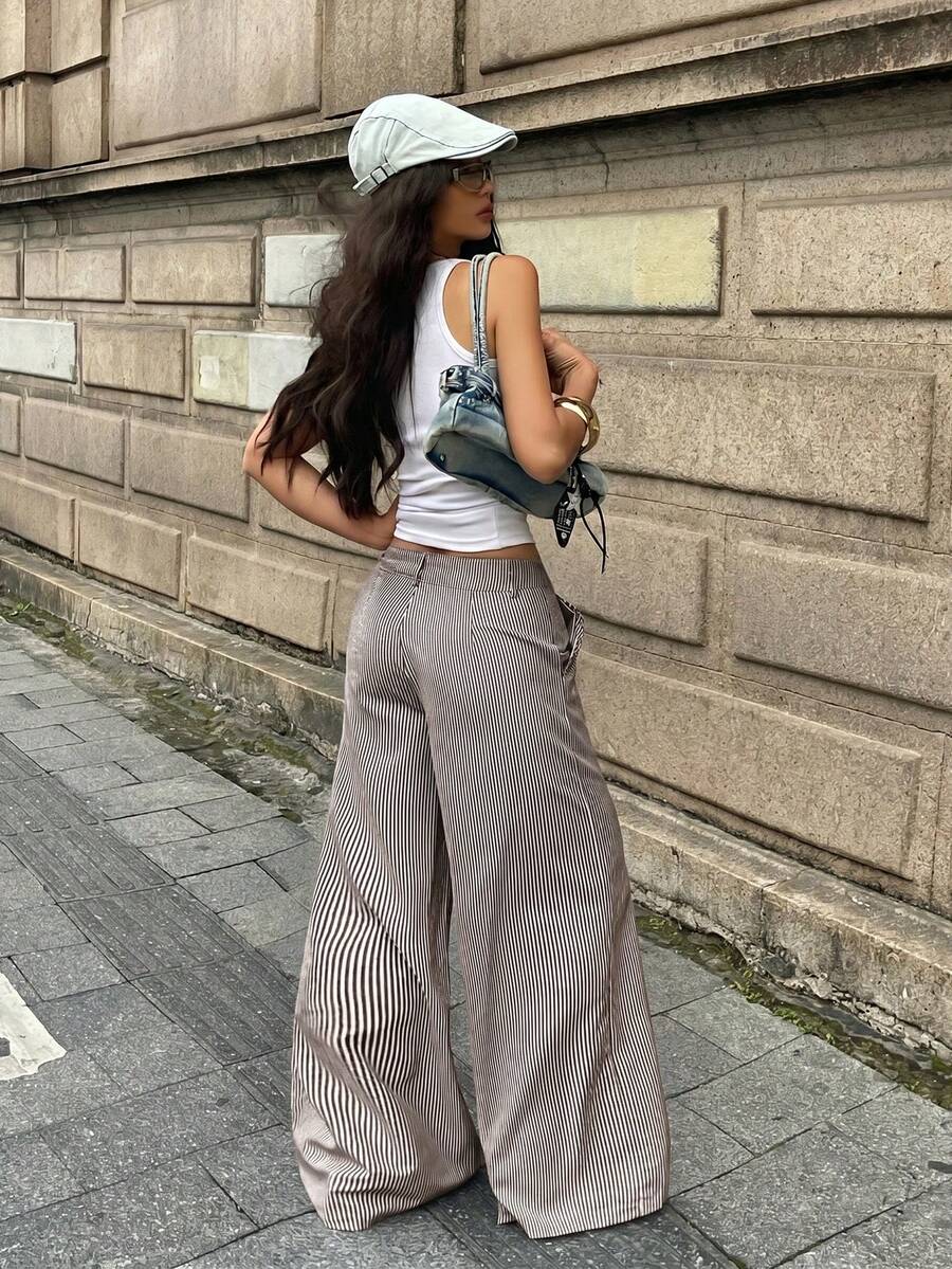 Women's casual straight leg striped woven pants featuring a low waist and zipper fly closure.