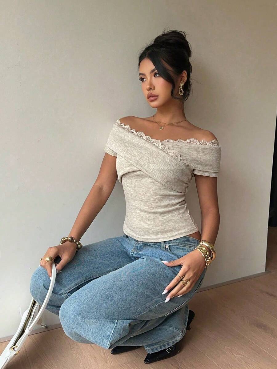 Women's off-the-shoulder slim fit short sleeve t-shirt featuring contrast lace trim and textured knitted fabric.