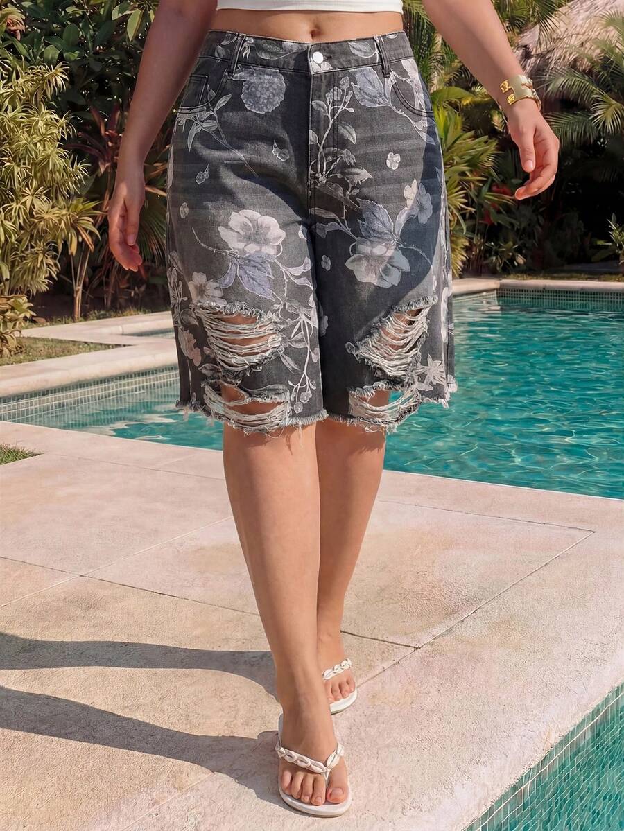 Women's loose wide-leg denim Bermuda shorts featuring vintage animal and paisley print with pockets and zipper fly.