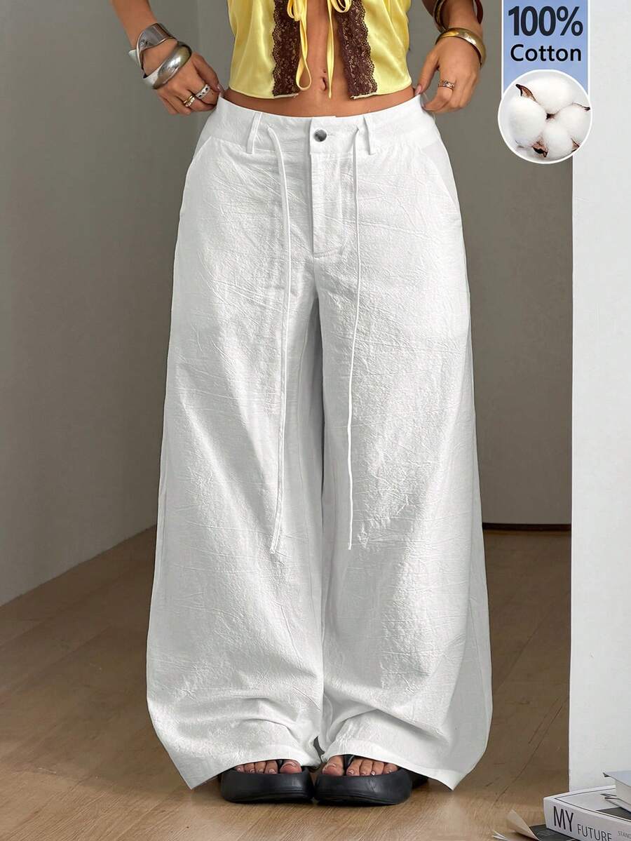 Women's casual straight leg striped woven pants featuring a low waist and zipper fly closure.