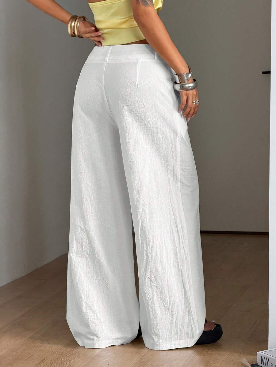 Women's casual straight leg striped woven pants featuring a low waist and zipper fly closure.