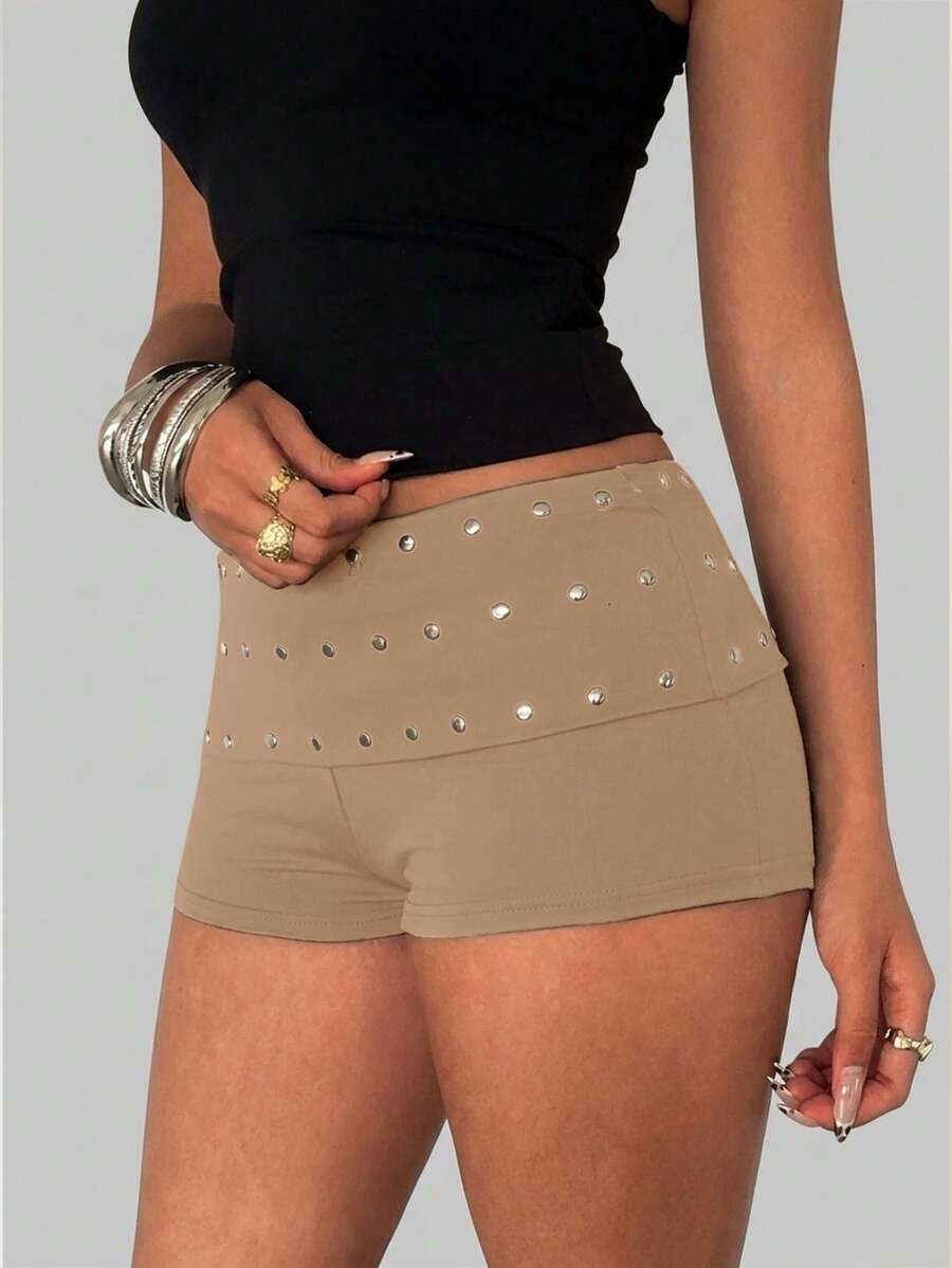 Women's studded PU ultra low waist mini shorts with zipper fly closure, skinny fit, mini length, and plain unlined design.