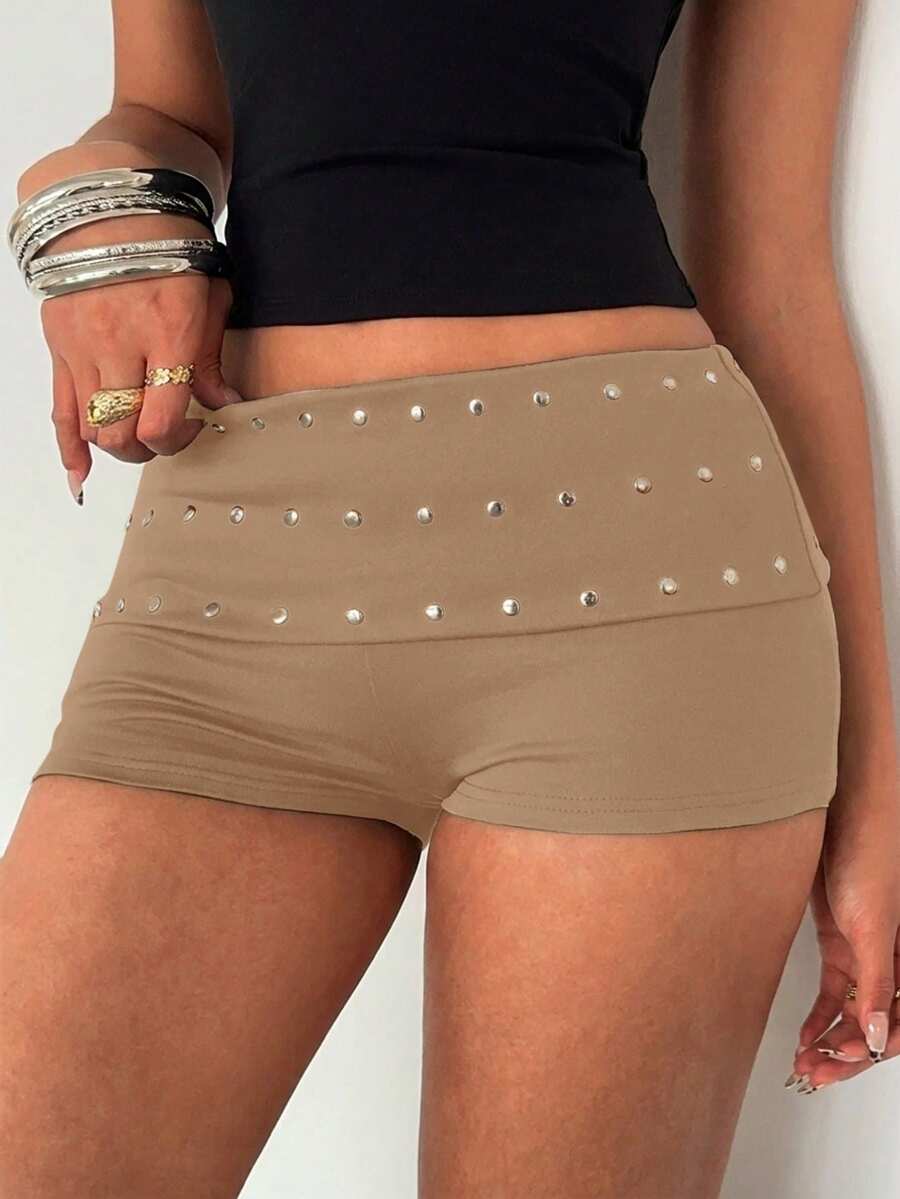 Women's studded PU ultra low waist mini shorts with zipper fly closure, skinny fit, mini length, and plain unlined design.