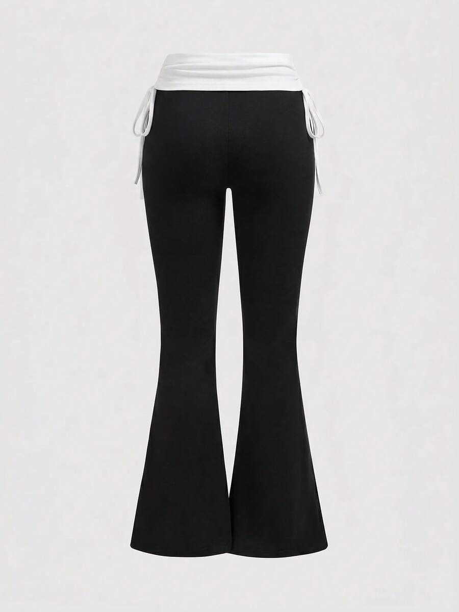 Women's low waist flare leg pants featuring an elastic drawstring waistband and ruched detail in knitted fabric.