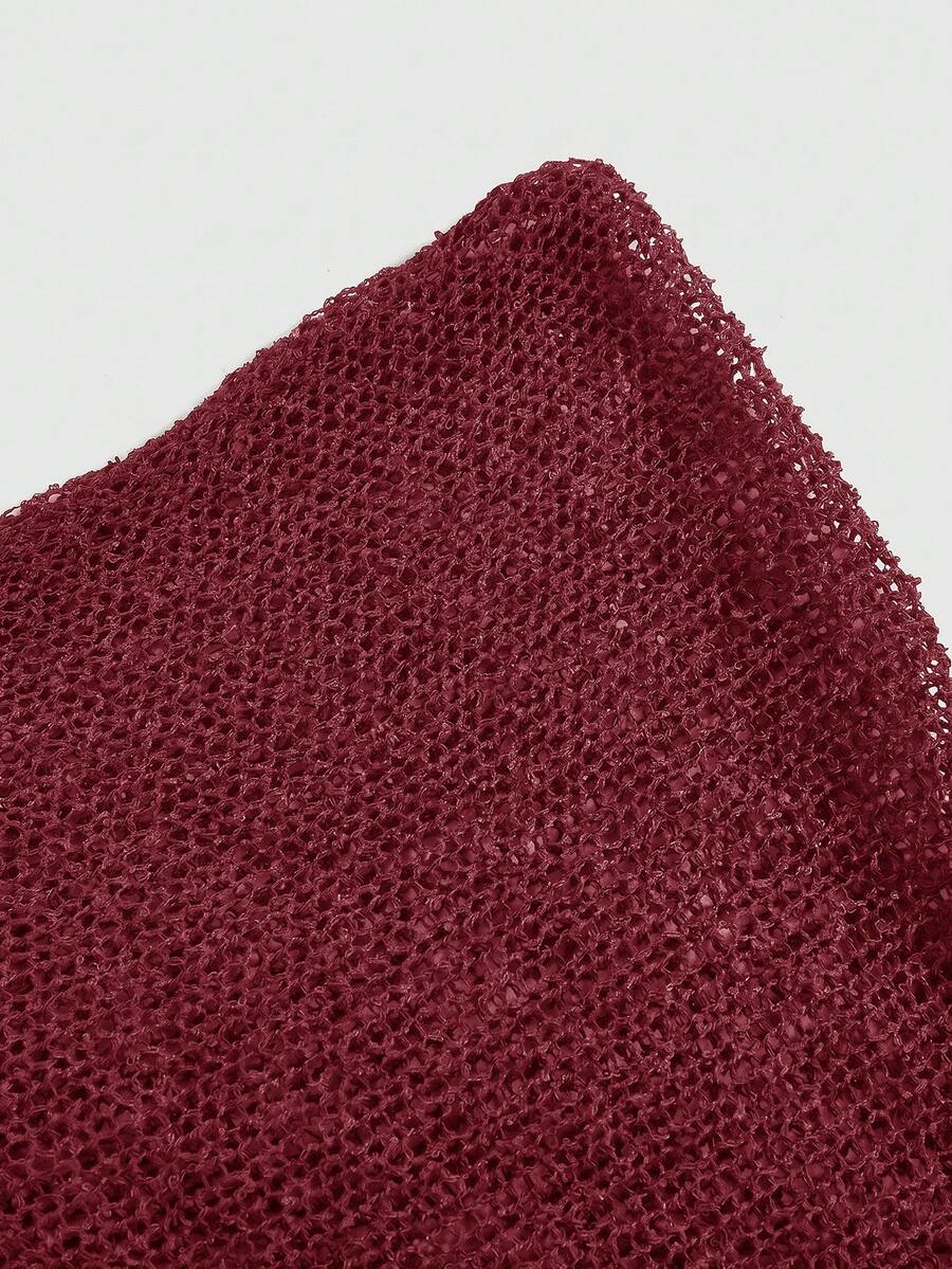 Women's casual hollow knit poncho top with boat neck, cloak sleeves, and asymmetrical hem
